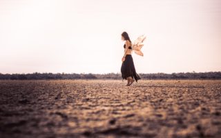 woman with wings in a field